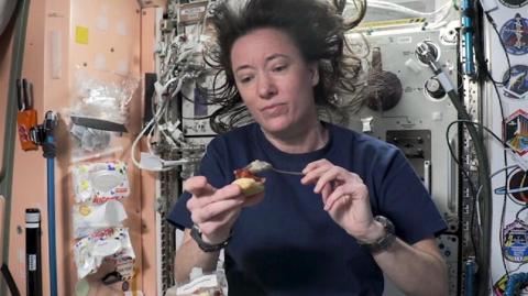 astronaut eating food