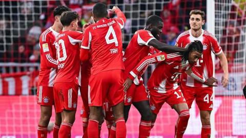Bayern Munich players celebrate after Michael Olise scores against Freiburg