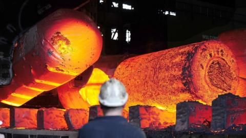 A steel worker at a factory