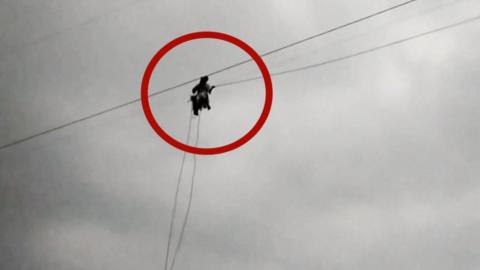 Person laying new cable line in Pakistan