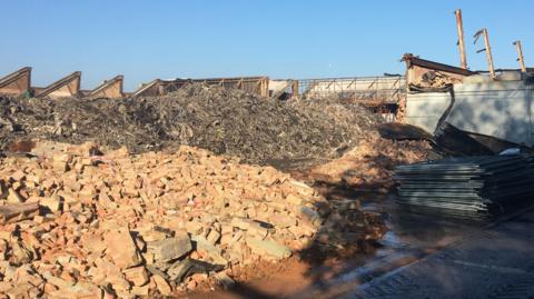 Large piles of bricks and other rubble.