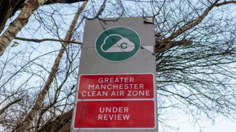 Signage advising motorists is seen at the entrance to the proposed clean air zone in Manchester.