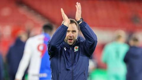 Blackburn head coach John Eustace clapping the fans