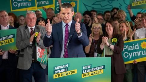 Rhun ap Iorwerth in front of a crowd