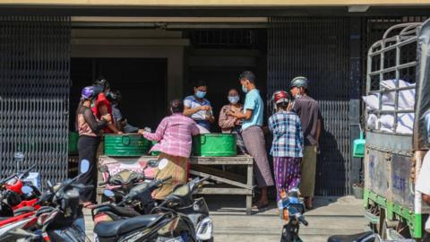 People buying food in Yangon