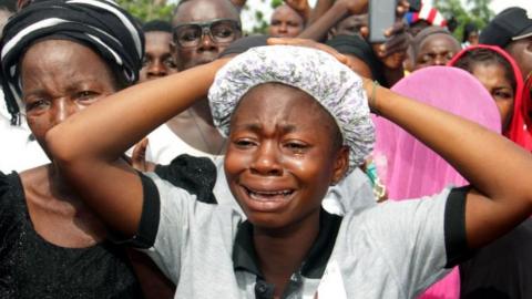 Relatives mourning at funeral service