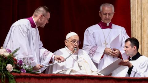 Pope Francis speaks from a balcony, on the day of the "Urbi et Orbi" (to the city and to the world) message at St Peter's Square, on Easter Sunday, in the Vatican, on 20 April, 2025