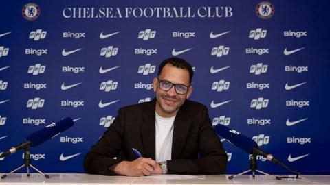 Liam Rosenior signing a contract at Chelsea