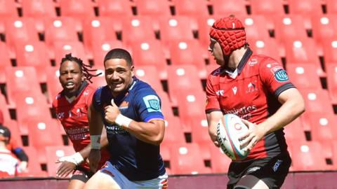 Francke Horne (right) runs away from Mosese Tuipulotu