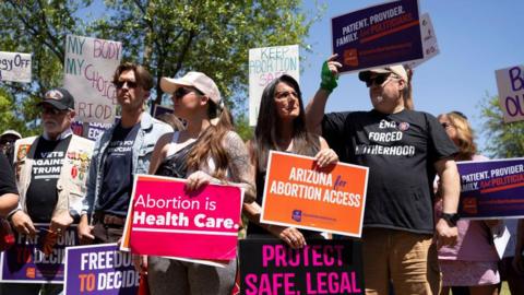 Arizonans hold signs in support of abortion access