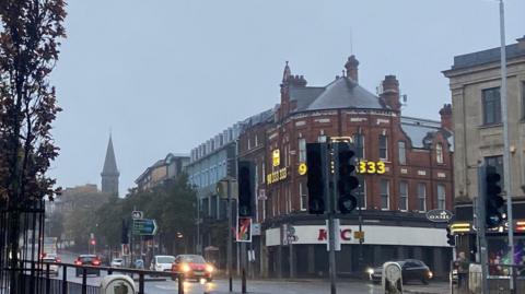 General view of Shaftsbury Square. A sign is underneath the traffic light indicating they are not working