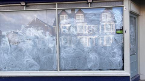 A view of the former Pickle and Lime shop on Botley Road with opaque film on the windows. 
