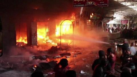 Fire crews in Nabi Yunus market, east Mosul