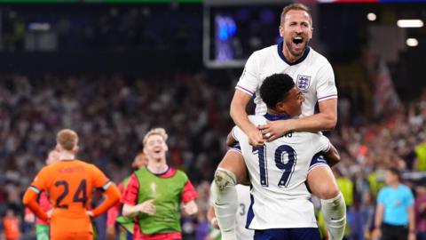 Harry Kane and Ollie Watkins celebrating after their semi-final win over the Netherlands