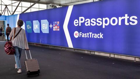 Travellers arrive for passport control at Stansted Airport in London, England on September 26, 2023.