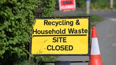 Sign saying recycling centres closed