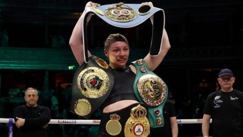 Lauren Price with her title belts after victory over Natasha Jonas in March 