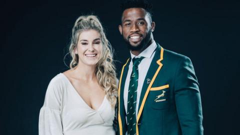 Captain of Laureus World Team of the Year the South Africa Men’s Rugby Team Siya Kolisi and his wife Rachel Smith pose at the Mercedes Benz Building prior to the 2020 Laureus World Sports Awards on February 17, 2020 in Berlin, Germany.