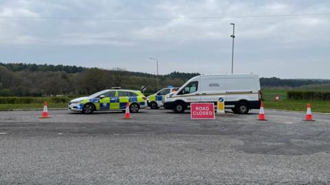 Police vehicles and road closure on Coxmoor Road