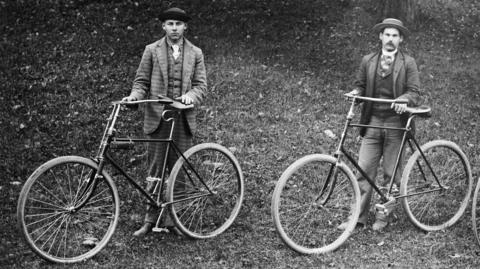 Two men in a black and white imahge 