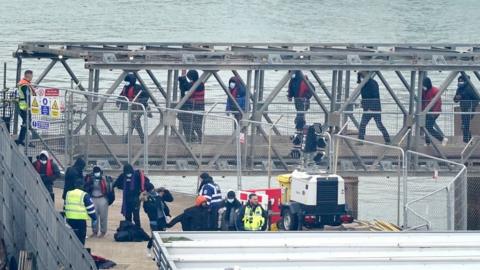 A group of people thought to be migrants are brought in to Dover, Kent, onboard a Border Force vessel following a small boat incident in the Channel
