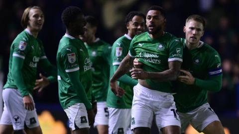 Plymouth Argyle players celebrate Andre Gray's late goal on Friday