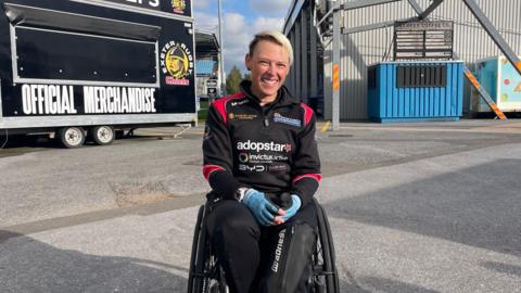 Lexi Chambers, sat in her wheelchair outside Exeter Chief's stadium, Sandy Park