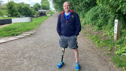 Stacey Cresswell standing on the Caein Hill towpath a stretch of the Kennet and Avon canal that he will use to train for 100km across the Sahara in November