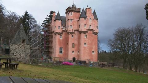 A Scottish castle said to have inspired Walt Disney has had its famous pink colour restored to its full glory.