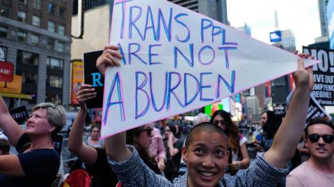 This file photo taken on July 26 2017 shows protesters against US President Donald Trump during a demonstration in front of the US army career centre in Times Square, New York