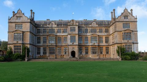 A view of Montacute House from the lawn in front