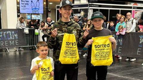 Parker (left) with two other bigger boys he was competing against 