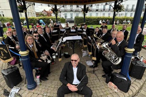 Members of the Woodhouse Prize Band with their instruments