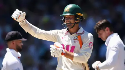 England bowler Brydon Carse (left) confronts Australia opener Jake Weatherland (right)