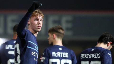 Cole Palmer celebrates scoring Manchester City's fourth against Swindon