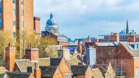 A view over Nottingham with the Council House in the distance
