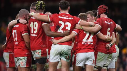 The Wales men's national senior side in a huddle