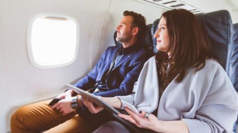 Couple sitting on a plane