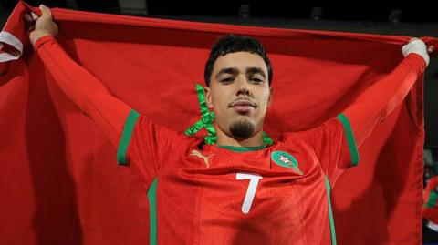 Othmane Maamma with the Morocco flag