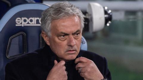 Jose Mourinho sitting in the dugout during his spell as Roma manager