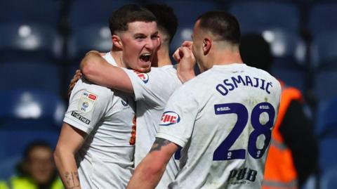 Preston's Alfie Devine shouts in celebration
