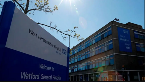 exterior of Watford General showing a large block building and a name sign