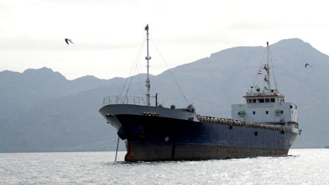 A vessel in the Strait of Hormuz, off the coast of Oman’s Musandam province, April 12, 2026