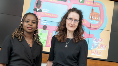 Endurance Idowu and Professor Angela Smith in front of a Black History Walk map