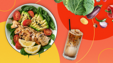 An image showing a plate with slices of avocado, tomatoes, chicken and lemon next to an iced drink with a straw beside some vegetables