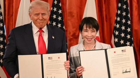 Japan's Prime Minister Sanae Takaichi (R) and US President Donald Trump attend a signing ceremony after a Japan-US Summit at the Akasaka State Guest House in Tokyo on October 28, 2025.