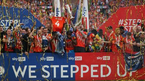 Luton Town celebrate winning the 2023 Championship play-off final
