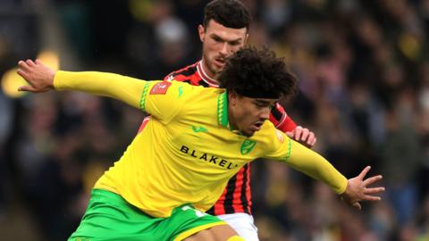 Norwich City's Jovon Makama shields the ball from a Walsall defender