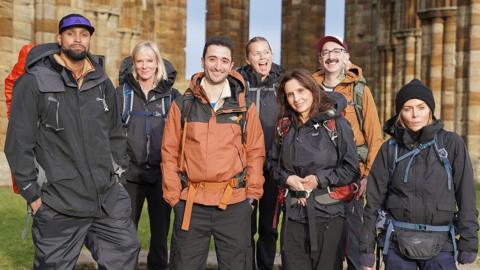 The celebrities in Pilgrimage all dressed ready for a long hike