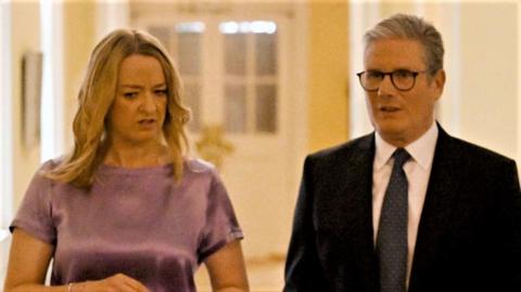 UK prime minister, Sir Keir Starmer walking with Laura Kuenssberg